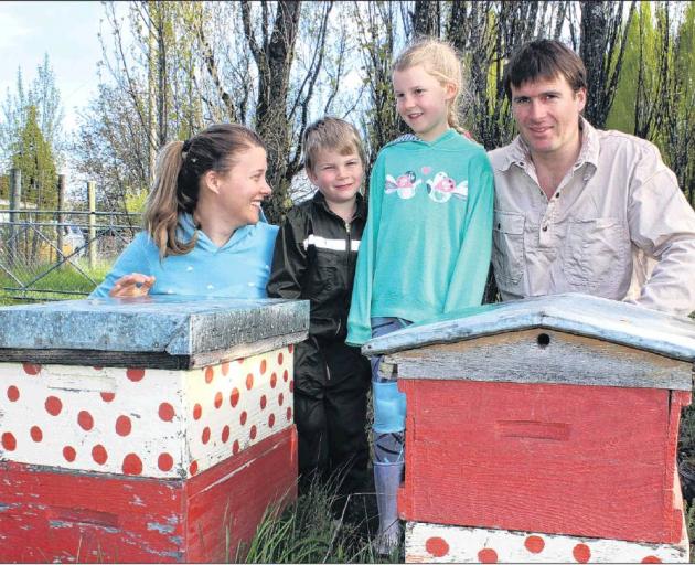 Louise, Jack, Briar and Reece Adamson examine unused beehives at their Earnscleugh home. Photo:...