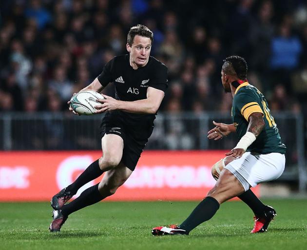 Ben Smith runs the ball up for the All Blacks against South Africa during their Rugby...