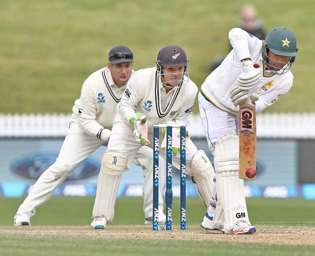 Sami Aslam defends a ball as BJ Watling and Ross Taylor look on. Photo: Getty Images