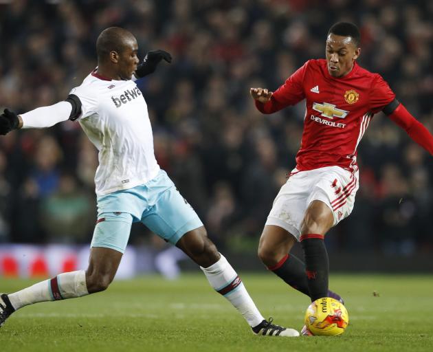Manchester United's Anthony Martial (R) in action with West Ham's Angelo Ogbonna. Photo: Reuters 