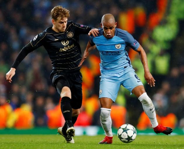 Manchester City's Fernando (R) in action with Celtic's Stuart Armstrong. Photo Reuters