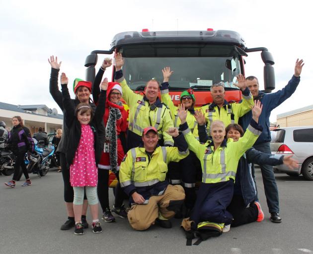 Brigade members and some helpers are pictured last night before setting off on the \"Toot for...