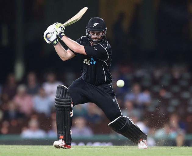 Colin Munro plays the ball through the offside for the Black Caps in the first Chappell-Hadlee...
