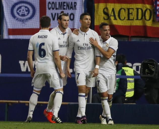 Real Madrid players celebrate a Cristiano Ronaldo (second from right) goal earlier this season....