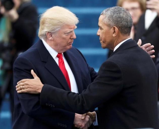 Outgoing President Barack Obama (R) greets President-elect Donald Trump before the inauguration...