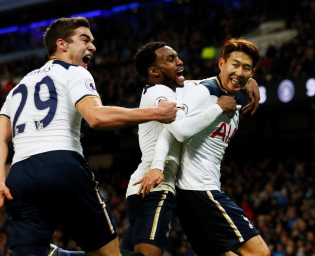 Tottenham's Son Heung-min (R) celebrates scoring with team-mates Danny Rose (C) and Harry Winks....