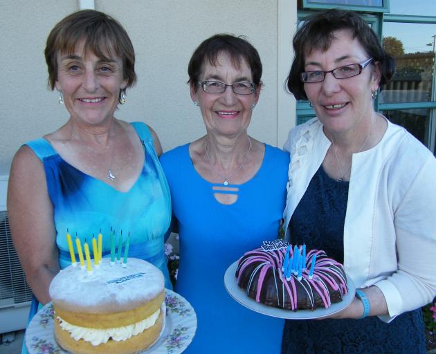 Elisabith Woods (right),  of Christchurch, celebrates  having a birthday cake for herself for the...