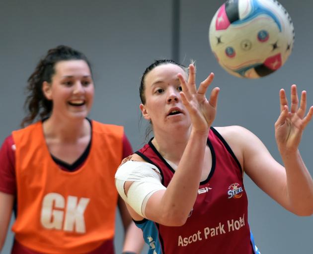 Abby Erwood prepares to catch the ball as Jennifer O'Connell watches on at the Southern Steel's training session at the Edgar Centre yesterday. Photo by Peter McIntosh.
