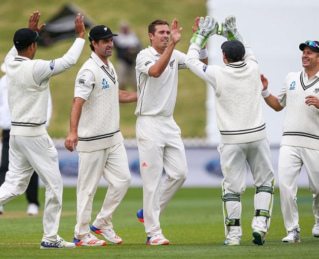 The Black Caps celebrate as Tim Southee takes the first wicket. Photo: Getty Images