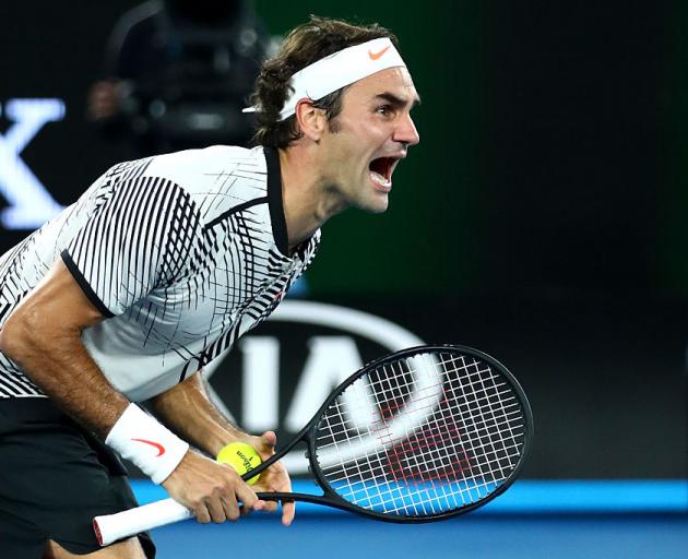 Roger Federer celebrates his victory over Rafael Nadal. Photo Getty