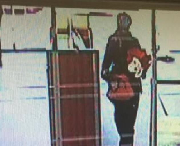 Police are looking for a gunman who robbed a Kiwibank in Christchurch. Photo: via Christchurch...