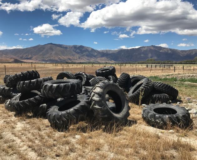 Unusable tyres are piled on Richard Subtil's Omarama Station after they were slashed at the weekend. Photo supplied.