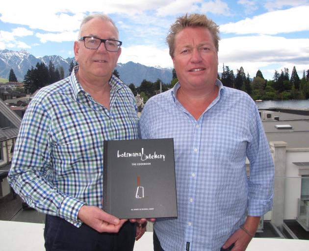Russell Gray (left) and Al Spary with their Botswana Butchery cookbook. Photo from Mountain Scene.