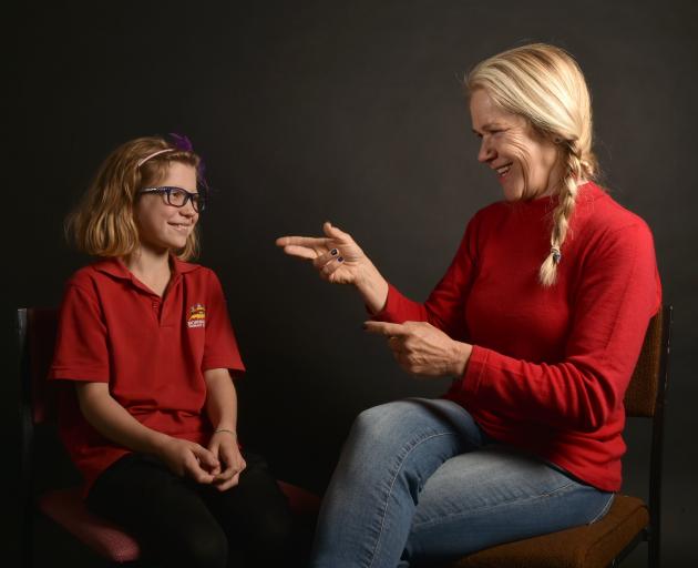 Sign language tutor Josje Lelijveld chats to Harriet Walton (8). Photo: ODT.
