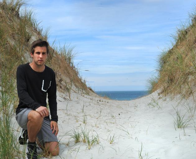 University of Otago master of science student Tom Simons-Smith says notches he  put in sand dunes...