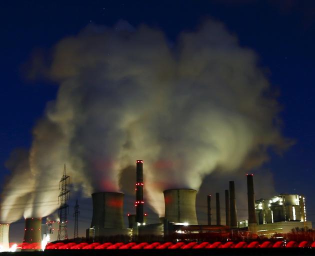 Steam rises from the chimneys of the coal power plant of RWE Power, one of Europe’s biggest...