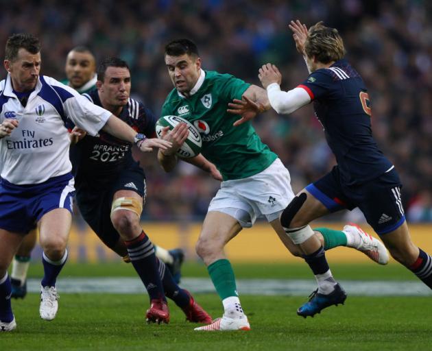 Ireland's Conor Murray takes on the French defence. Photo Getty
