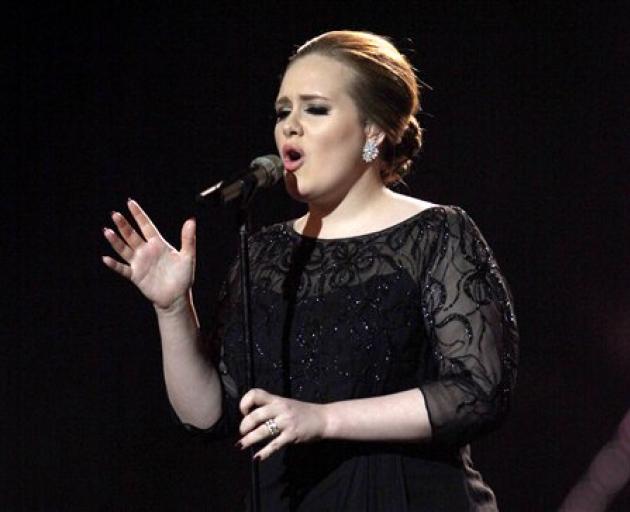 Adele, seen performing at last year's Brit Awards in London, will perform at the Grammys in Los...