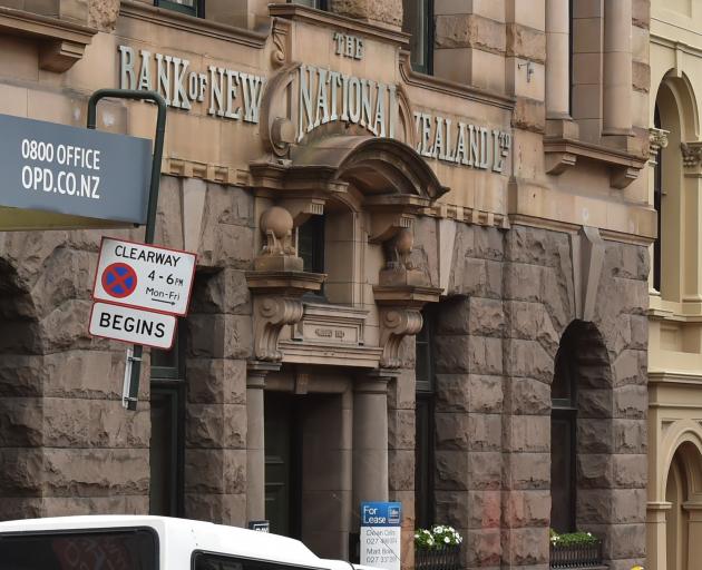 Three men have been given burglary charges after they were caught in the old National Bank of New Zealand last night. Photo: Gregor Richardson