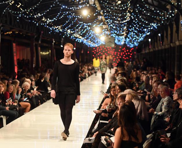  Dunedin photographer James Russell on the catwalk last night, and in his regular role as a...