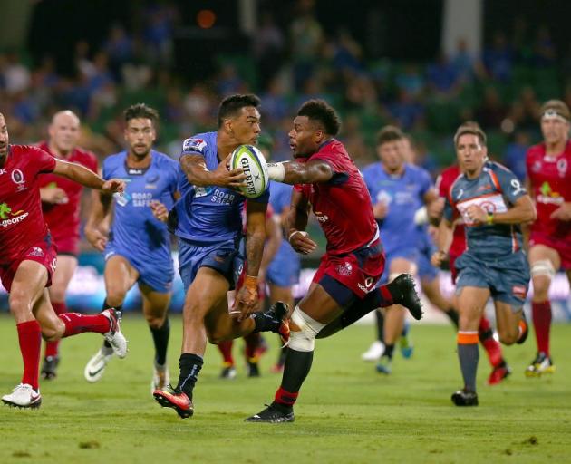 Chance Peni of the Force offloads the ball during their game against the Reds this year. Photo:...