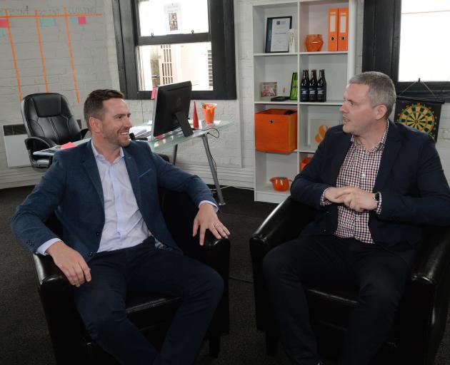 Cory Richards (left) and Tom Sweeney in their Crew Consulting office in Dowling St. Photo by Linda Robertson.