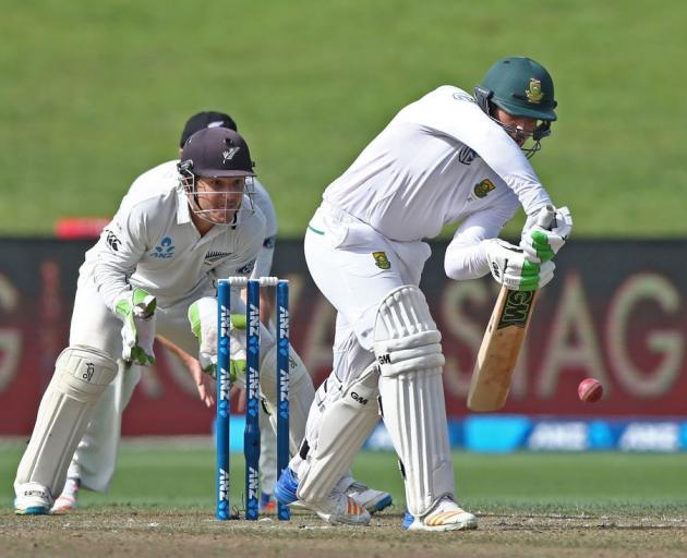 Quinton de Kock batting for South Africa as BJ Watling watches on for New Zealand. Photo: Getty...