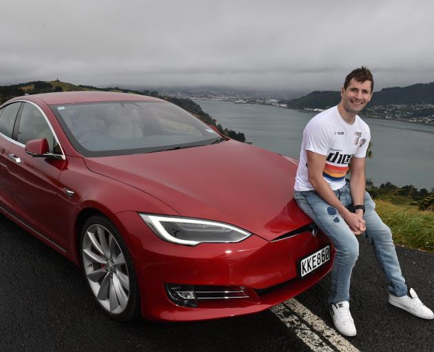 Rocketwerkz chief executive Dean Hall with his new Tesla Model S P100D electric supercar. PHOTO:...