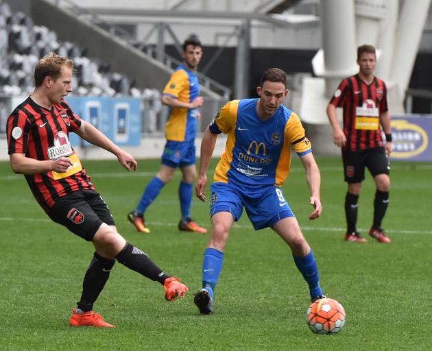 Southern United captain Harley Rodeka looks on as Canterbury United's Andreas Wilson passes the...