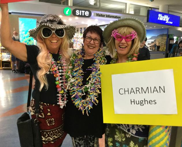 Greeting English comedian Charmian Hughes at Auckland Airport (from left) Shelley Gane, of Auckland, Salina Davies, of Australia, and Patsy Sim, of Auckland. Photo supplied.