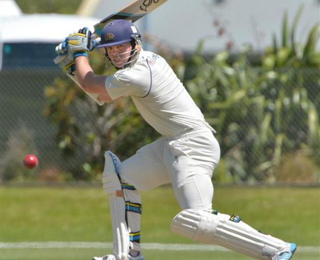 Otago batsman Michael Bracewell blasts a cut shot to the boundary during the fourth day of his...