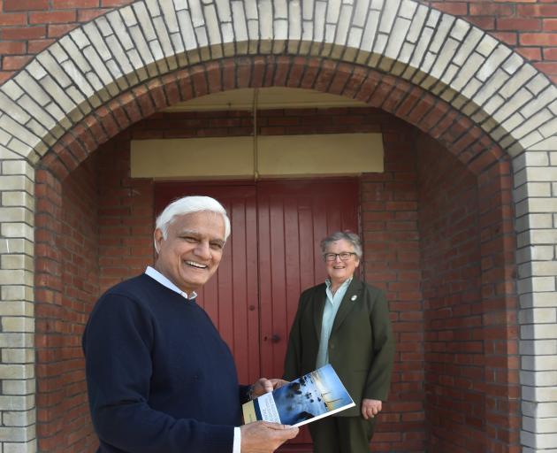 Preacher Ravi Zacharias (left) reads a book by preacher Dr Frank W. Boreham with Amana Christian...