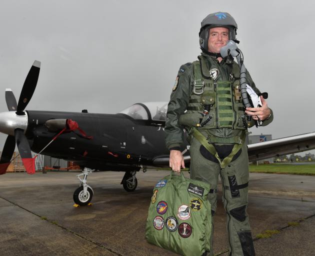 Flight Lieutenant Michael Williams, of the Black Falcons, at Dunedin Airport before taking to...