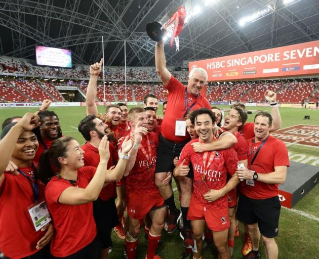 The Canada team celebrates after winning the Singapore Sevens. Photo: Getty Images