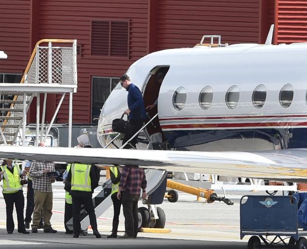 FBI director James Comey emerges from a Gulfstream G550 jet at Queenstown Airport yesterday to take part in a spy conference at the resort this week. Photo: Craig Baxter.