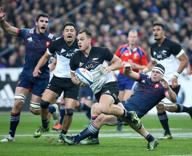 Israel Dagg looks to pass during last year's encounter between the All Blacks and France. Photo:...