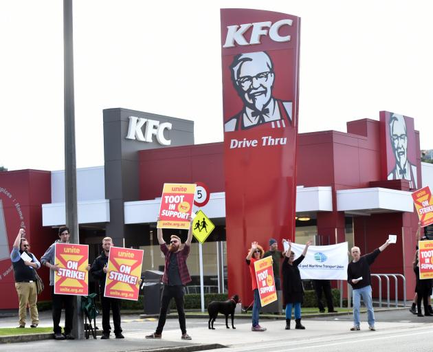 KFC staff strike outside the fast food outlet in North Dunedin on Saturday. Photo: Peter McIntosh.