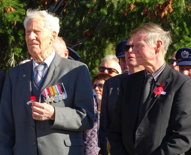 World War 2 navy veteran Allan Fisher (left), of Arrowtown, stands with former Arrowtown ward councillor Lex Perkins during the wreath-laying ceremony at the Arrowtown War Memorial yesterday. Photo: Guy Williams.