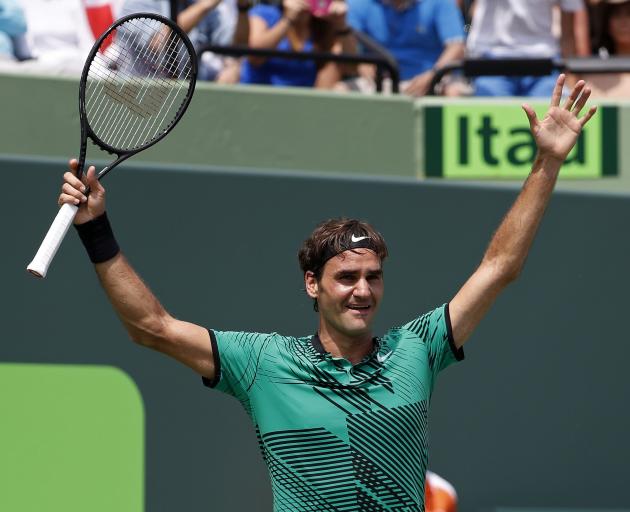 Roger Federer celebrates beating Rafael Nadal. Photo: Reuters