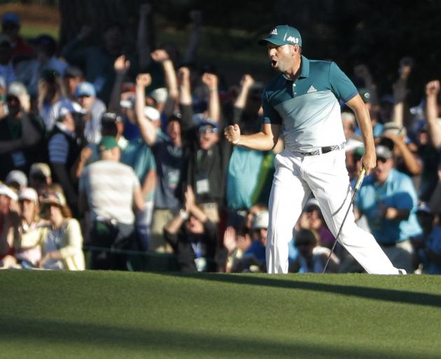 Sergio Garcia celebrates sinking a putt during his Masters win today. Photo: Reuters