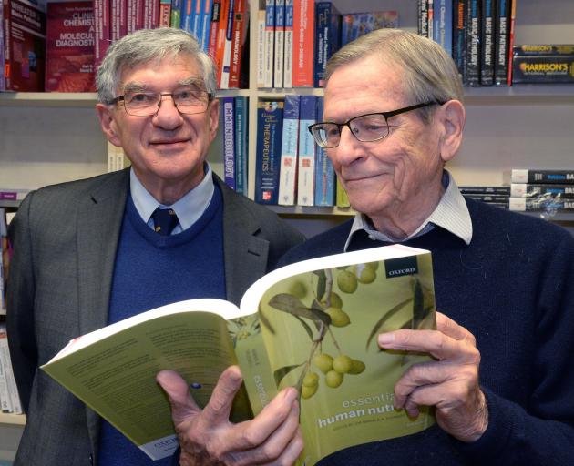 Authors and co-editors Profs Jim Mann (left) and Stewart Truswell at the launch of the Essentials of Human Nutrition fifth edition at University Book Shop last week. Photo: Linda Robertson.