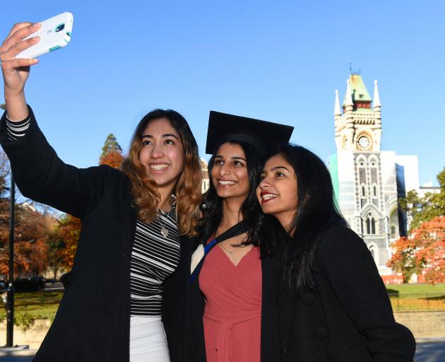 Taking a selfie in front of the University of Otago clocktower are (from left) Lizelle Borges, Vishwa Jani and Namratha Giri, all of Auckland. Photo: Gregor Richardson.