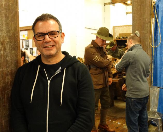 Australian film director Serge Ou is in Oamaru filming scenes for a World War 1 installation to open in France next year. Behind him, Oamaru's Glen Marshall is fitted out for his role as an Australian soldier by costumer Tim Hodgman. Photo: Daniel Birchfi