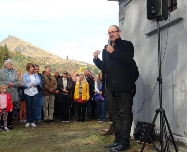 Director-general of the Department of Conservation Lou Sanson addresses the crowd at the opening of the restored Arrowtown Gaol yesterday afternoon. Photo: Louise Scott.