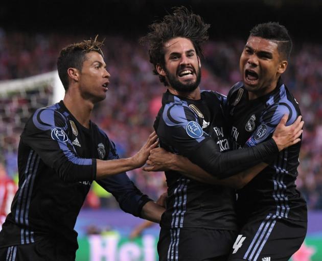 Real Madrid players Cristiano Ronaldo, Isco and Casemiro celebrate Isco's goal. Photo: Getty Images