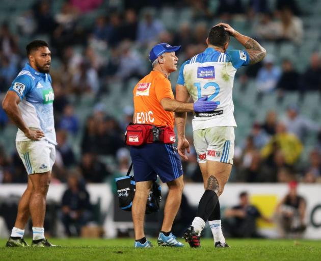 Sonny Bill Williams leaves the field holding his head in the Blues game against the Waratahs last...