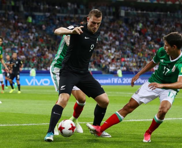 New Zealand's Chris Wood looks to evade Mexico's Jesus Corona. Photo: Getty Images