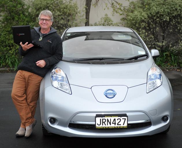 One of the two men behind an electric vehicle data collection system, emeritus Prof Henrik Moller, beside his electric vehicle last week. Photo: Christine O'Conner