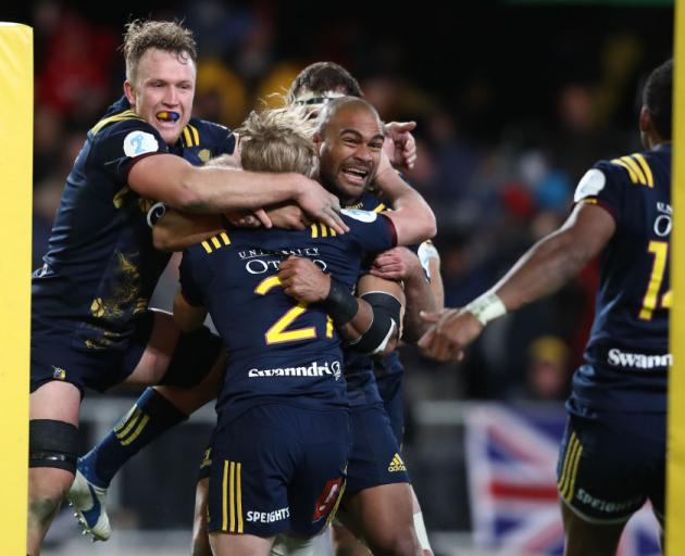 Highlanders players celebrate after winning their game against the Lions. Photo: Getty Images