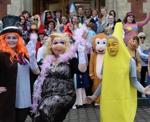 Participating in the Otago Girls' High School Library Day are (from left) Jess De Beer (17, Mad Hatter), careers adviser Robyn Bazsika (Miss Piggy) and Brooke McDonald (16, banana). Photo: Linda Robertson